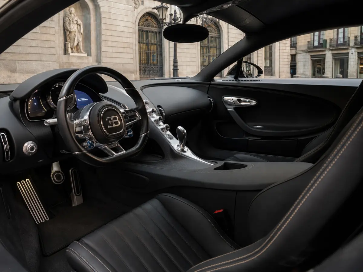 Bugatti Chiron 110 Ani 2019, interior — Rome Luxury Car Rental, Rome. The Bugatti Chiron 110 Ani is a car that needs no introduction — and very few roads…