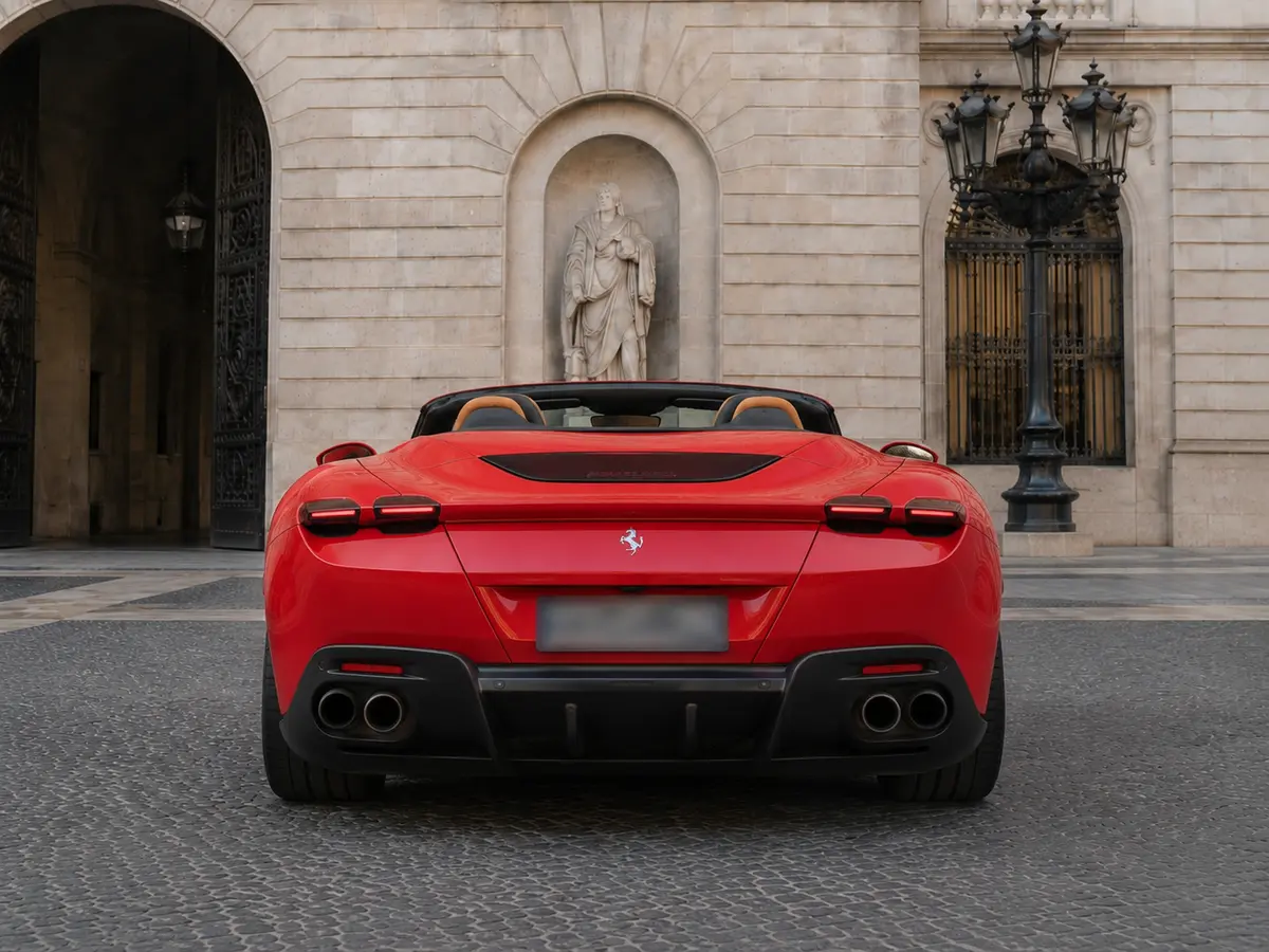 Ferrari Roma Spider 2024, rear view — Rome Luxury Car Rental, Rome. The 2024 Ferrari Roma Spider pairs a 620 hp V8 with a soft-top body designed for open-air…